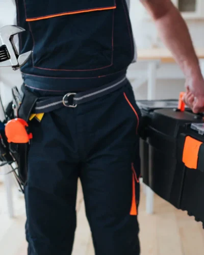 handyman-holding-toolbox-wrench-hands-scaled handyman-holding-toolbox-wrench-hands-scaled